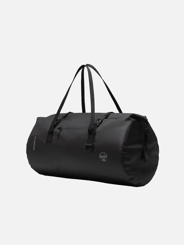 HERSCHEL Dry Bag Outdoor – Black, önden görünüm; fermuarlı ön cep ve taşıma kayışları belirgin