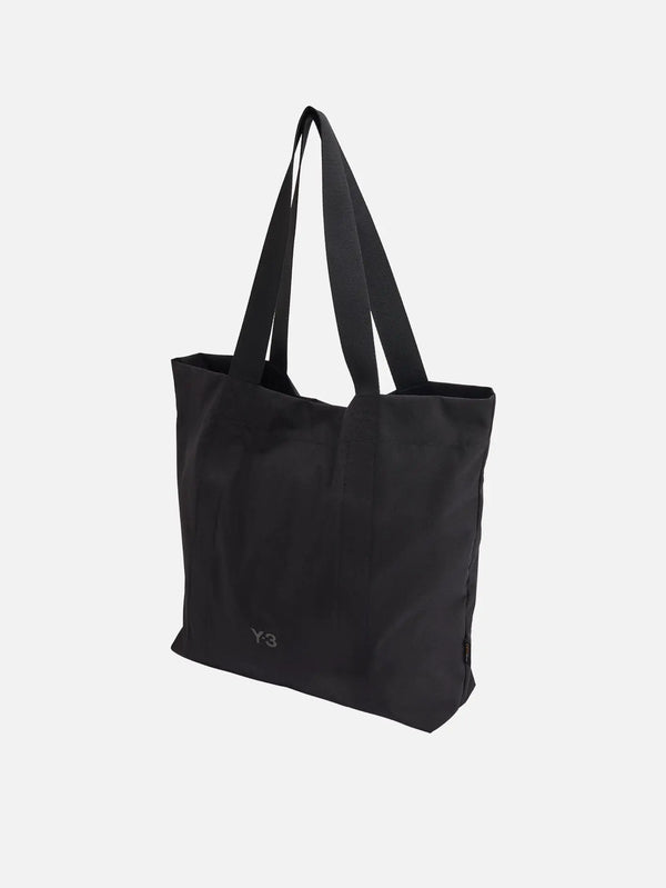 Y-3 Tote – siyah, önden görünüm; sade günlük çanta, iki uzun omuz askısı.