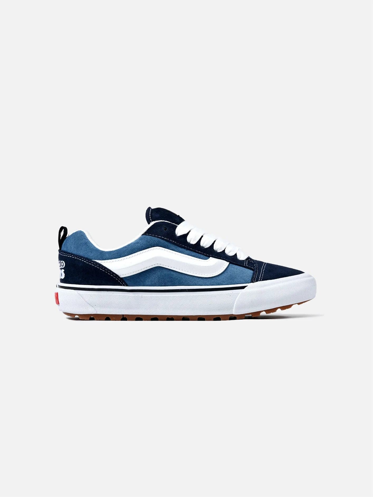 Navy blue shop and white vans